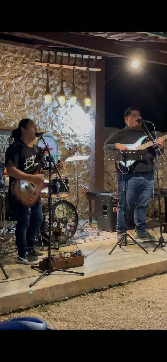 Live band performing on the pub courtyard stage